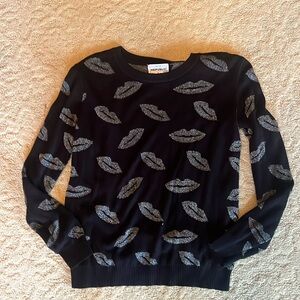 Black sweater with metallic lips